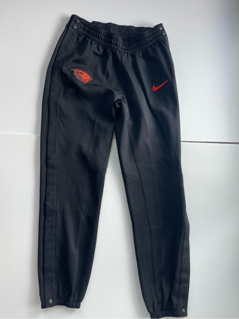 Nike Black Track Joggers with Orange Swoosh and Patch Logo